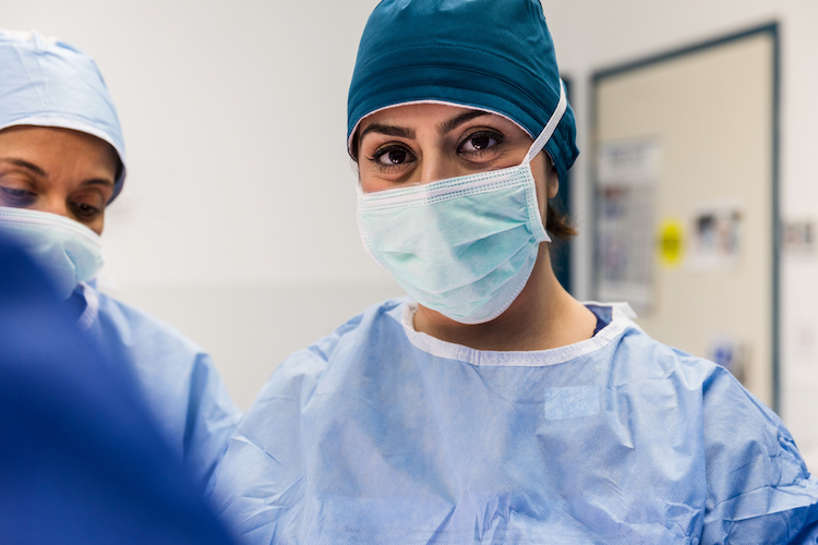 Confident focused female surgeon.