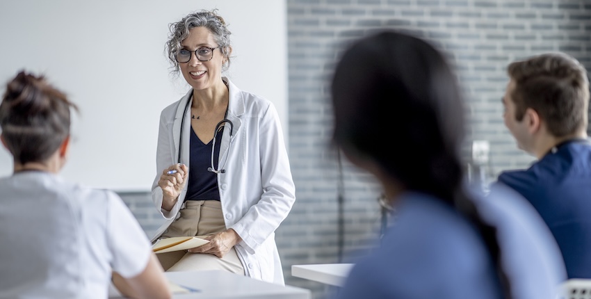 A health care provider speaking to a room.