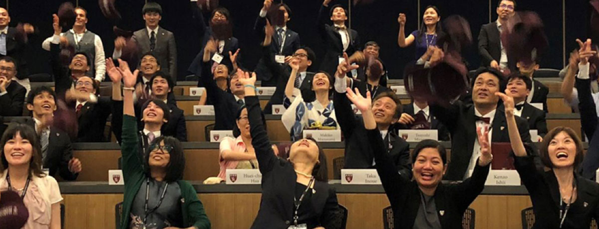 students in icrt japan toss caps in air
