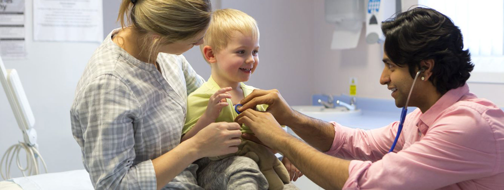 Small child smiles at doctor