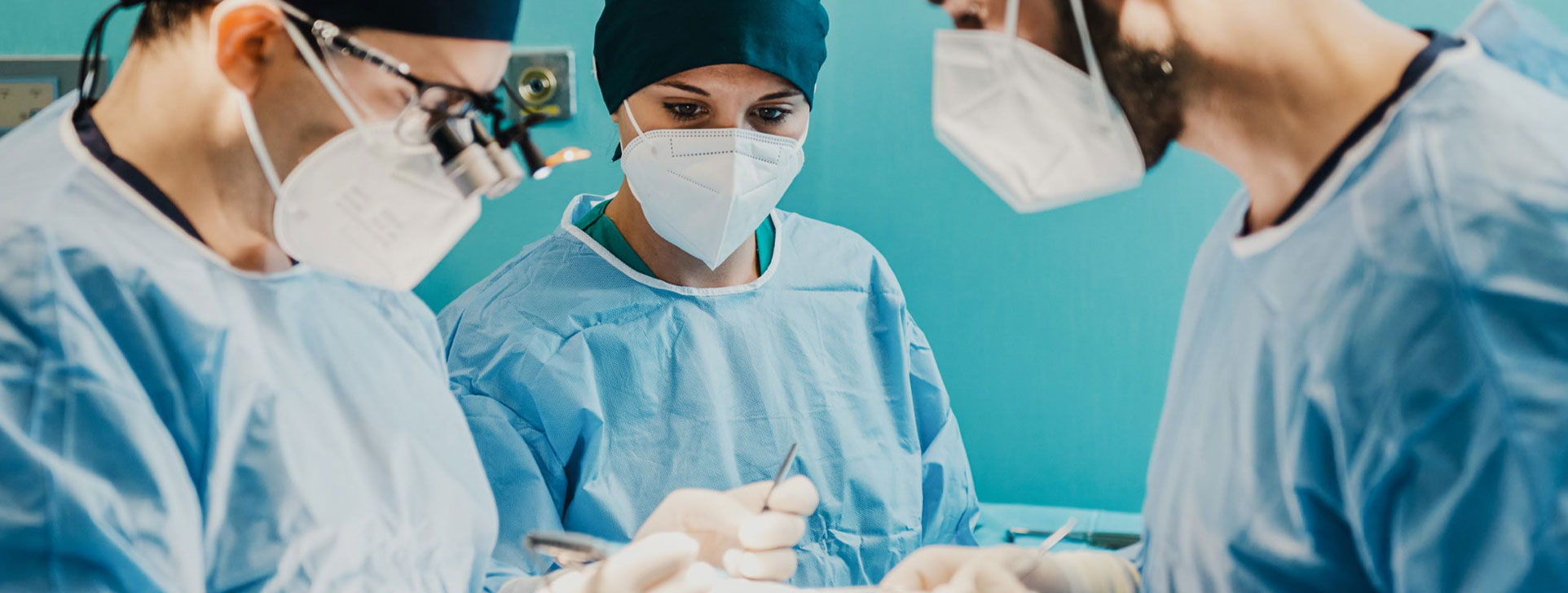 Three focused surgeons in an operating room. 