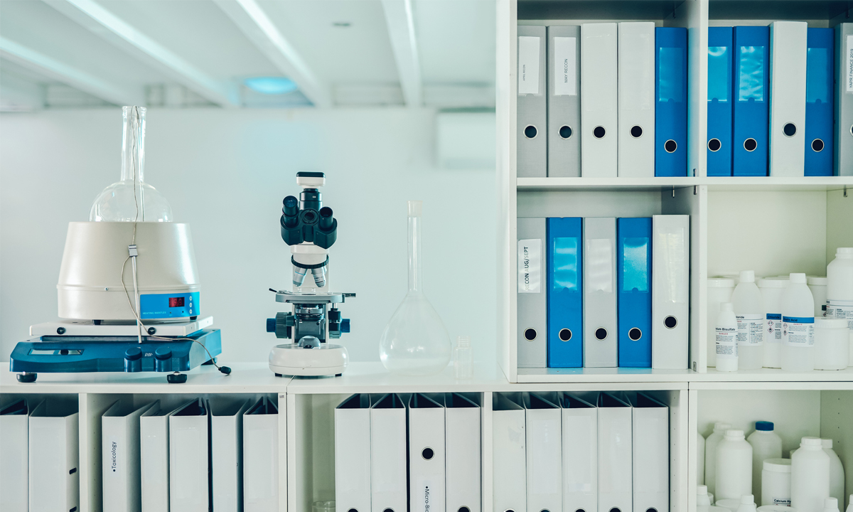 Lab with patient records and a microscope