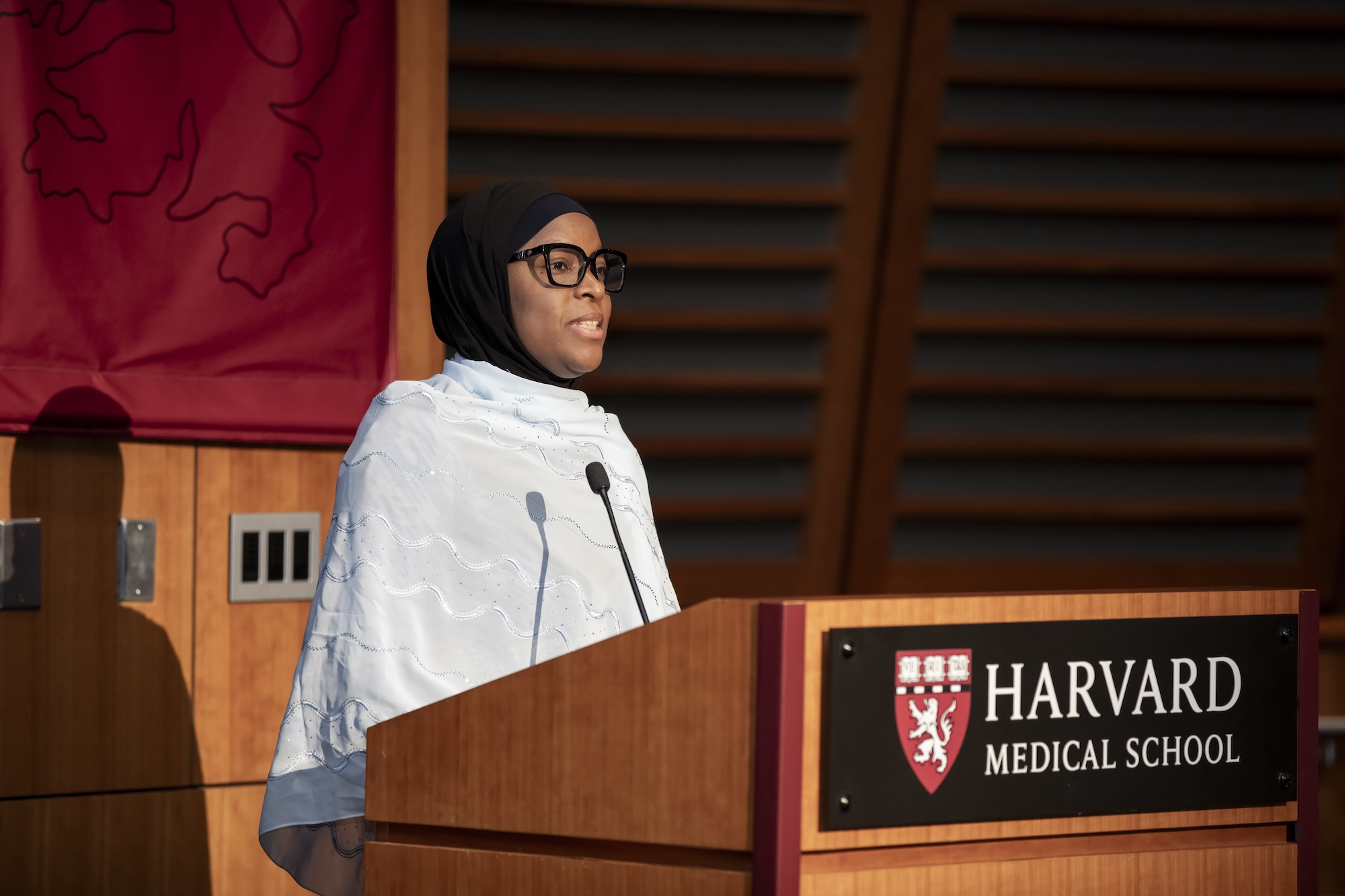 A graduate of the program delivering a speech.