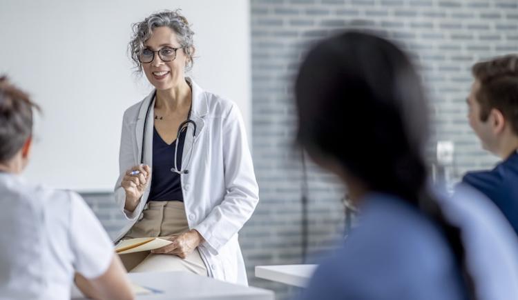 A health care provider speaking to a room.