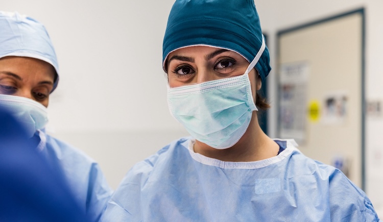 Confident focused female surgeon.